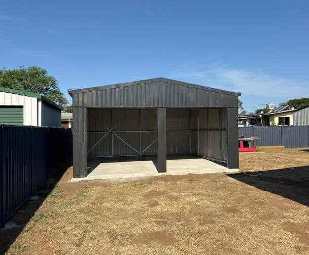 charcoal-shed-open-bay-beside-house